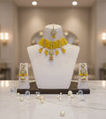 Elira Kundan and Moti Necklace Set With Mantika and Earrings